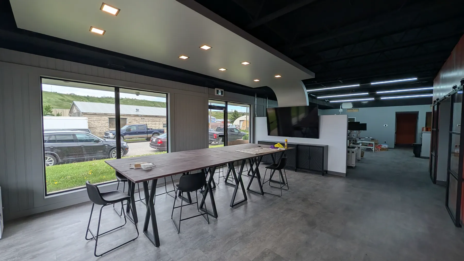 Client consultation table and front windows inside True North Kromes
