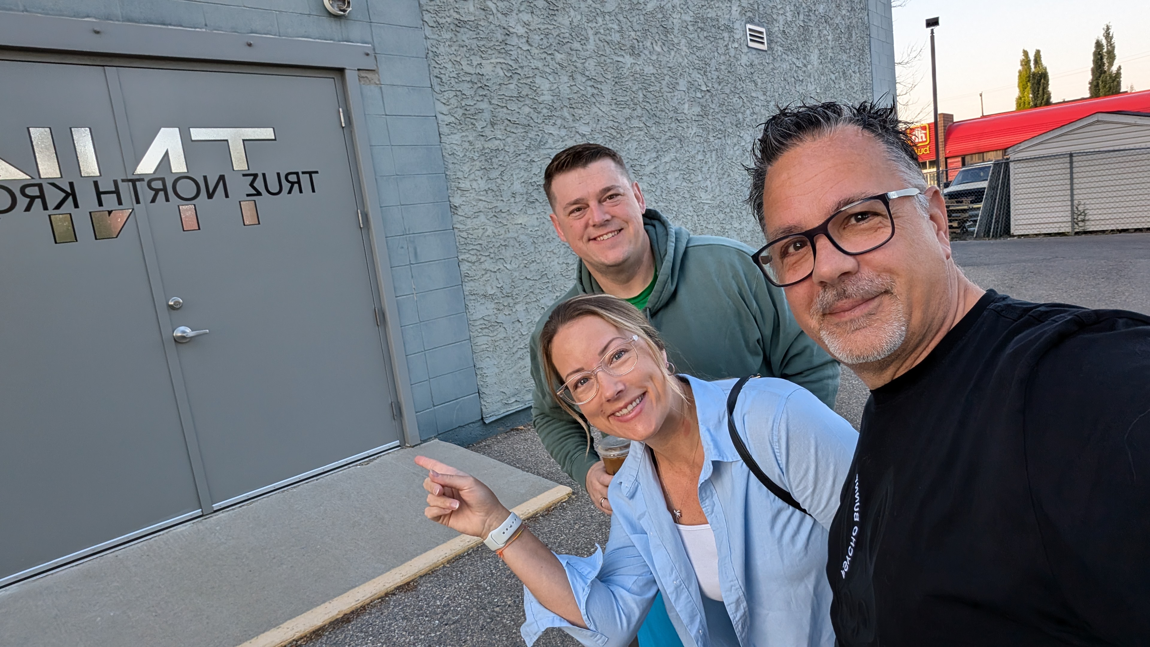 The True North Kromes team outside the building entrance