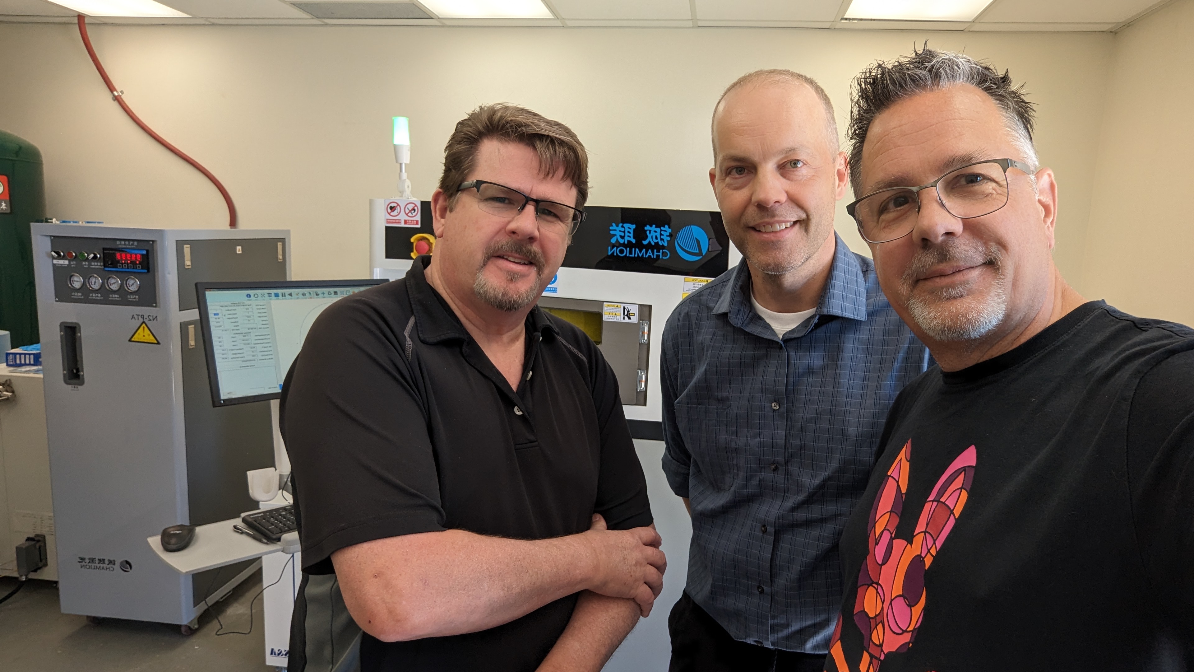 The True North Kromes team standing in the lab alongside equipment