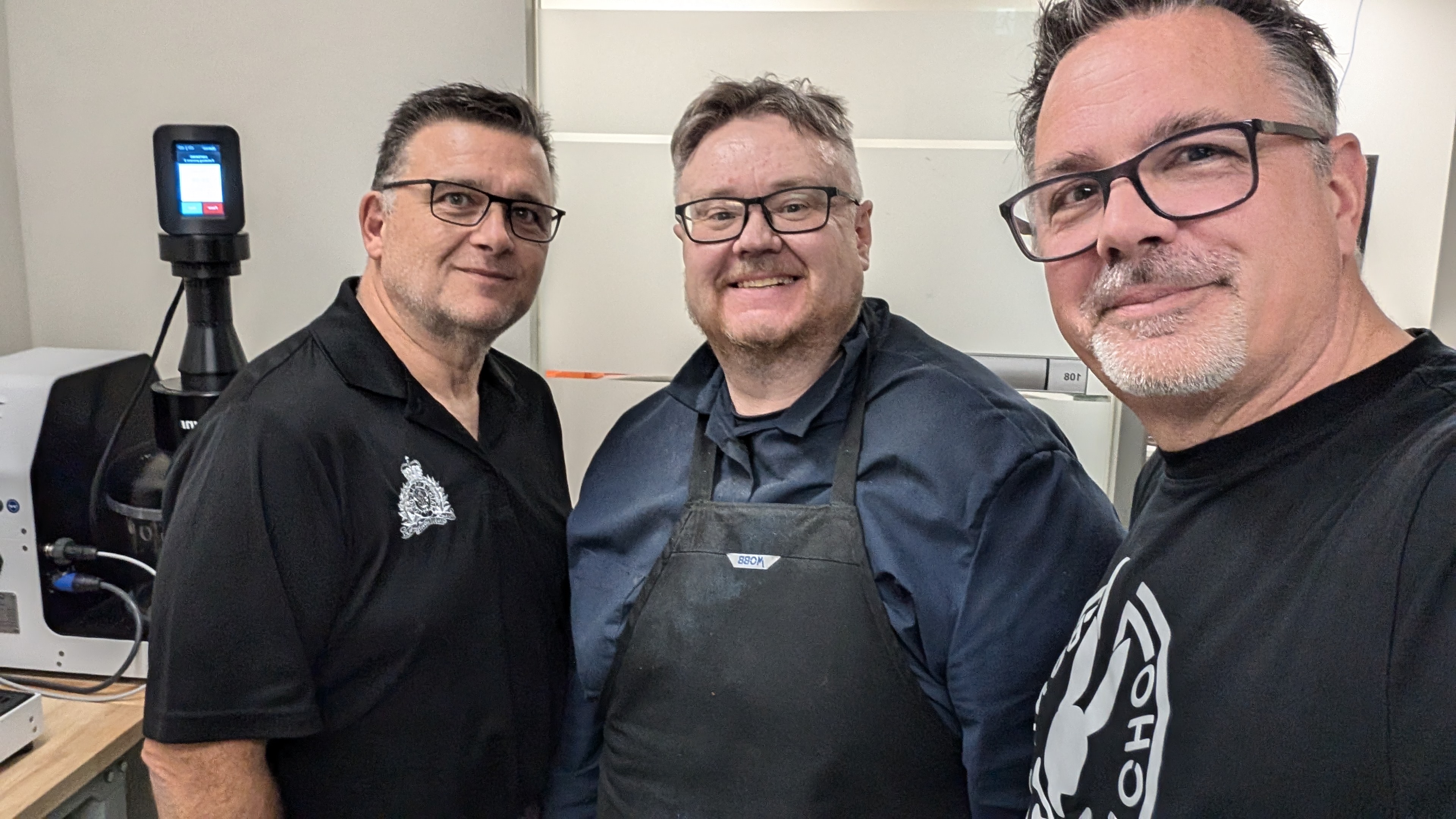 Three True North Kromes team members posing together in the workshop